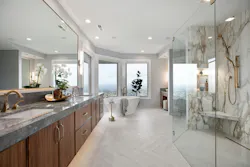 This primary suite dated to 1999—and it looked every bit of its 20+ years. The homeowners asked Mountainwood Homes to update and elevate their space with a curbless and door-less glass shower, a floating vanity, herringbone tile flooring, and a freestanding tub with views of the surrounding valley. This primary suite dated to 1999—and it looked every bit of its 20+ years. The homeowners asked Mountainwood Homes to update and elevate their space with a curbless and door-less glass shower, a floating vanity, herringbone tile flooring, and a freestanding tub with views of the surrounding valley.