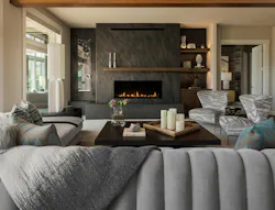An old fieldstone fireplace was transformed into this modern showstopper as part of a whole-house remodel. An old fieldstone fireplace was transformed into this modern showstopper as part of a whole-house remodel.