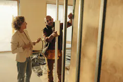 Contractor and client discussing renovation plans Contractor and client discussing renovation plans