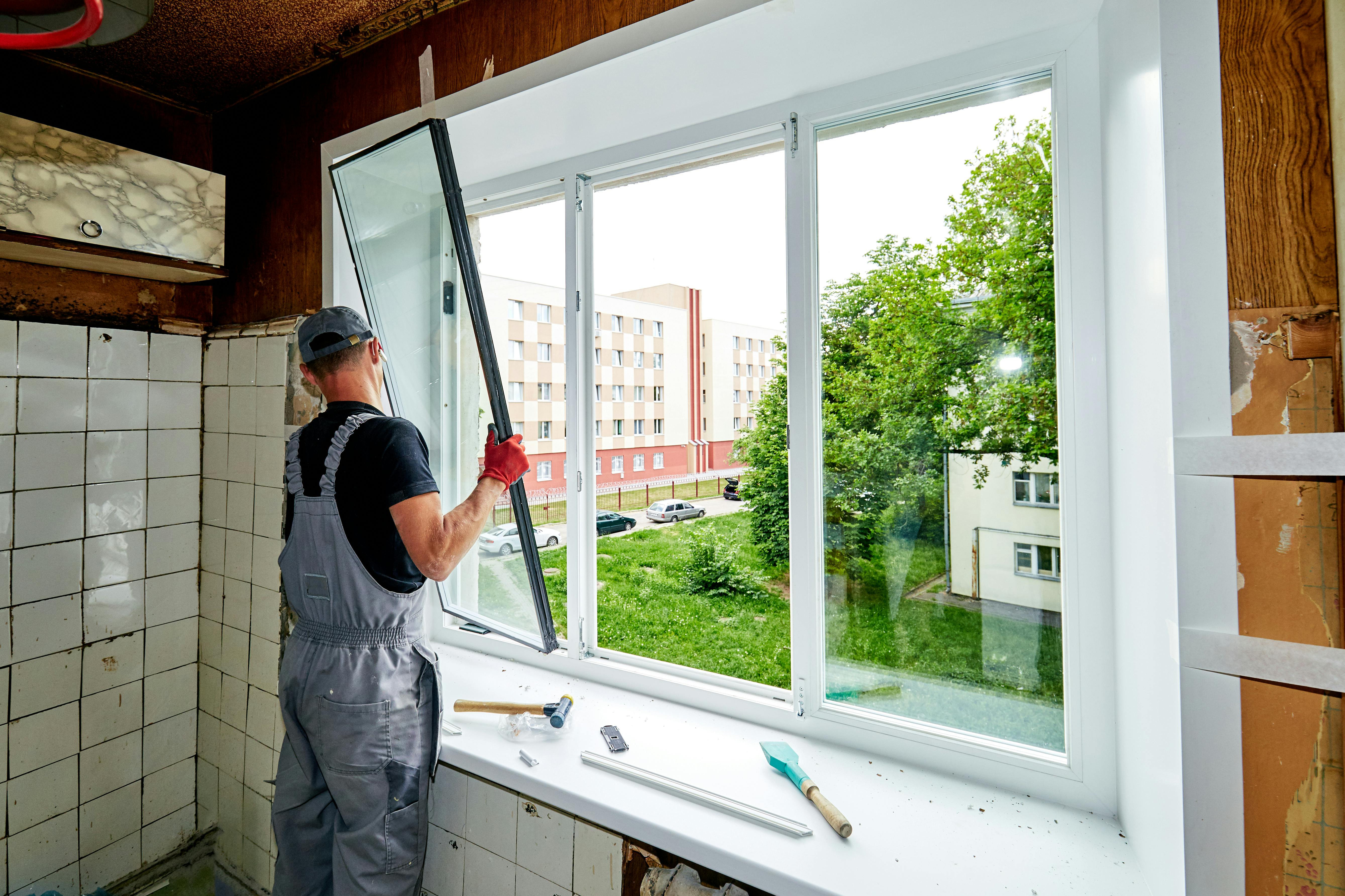 man installing a window